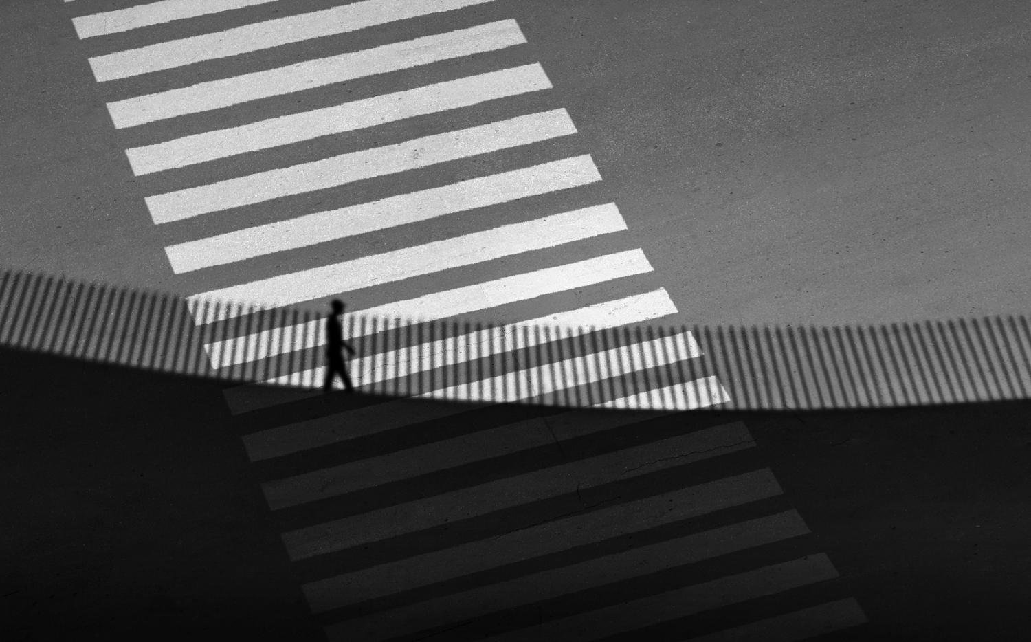 The shadow crosses over the street by Sara Goli