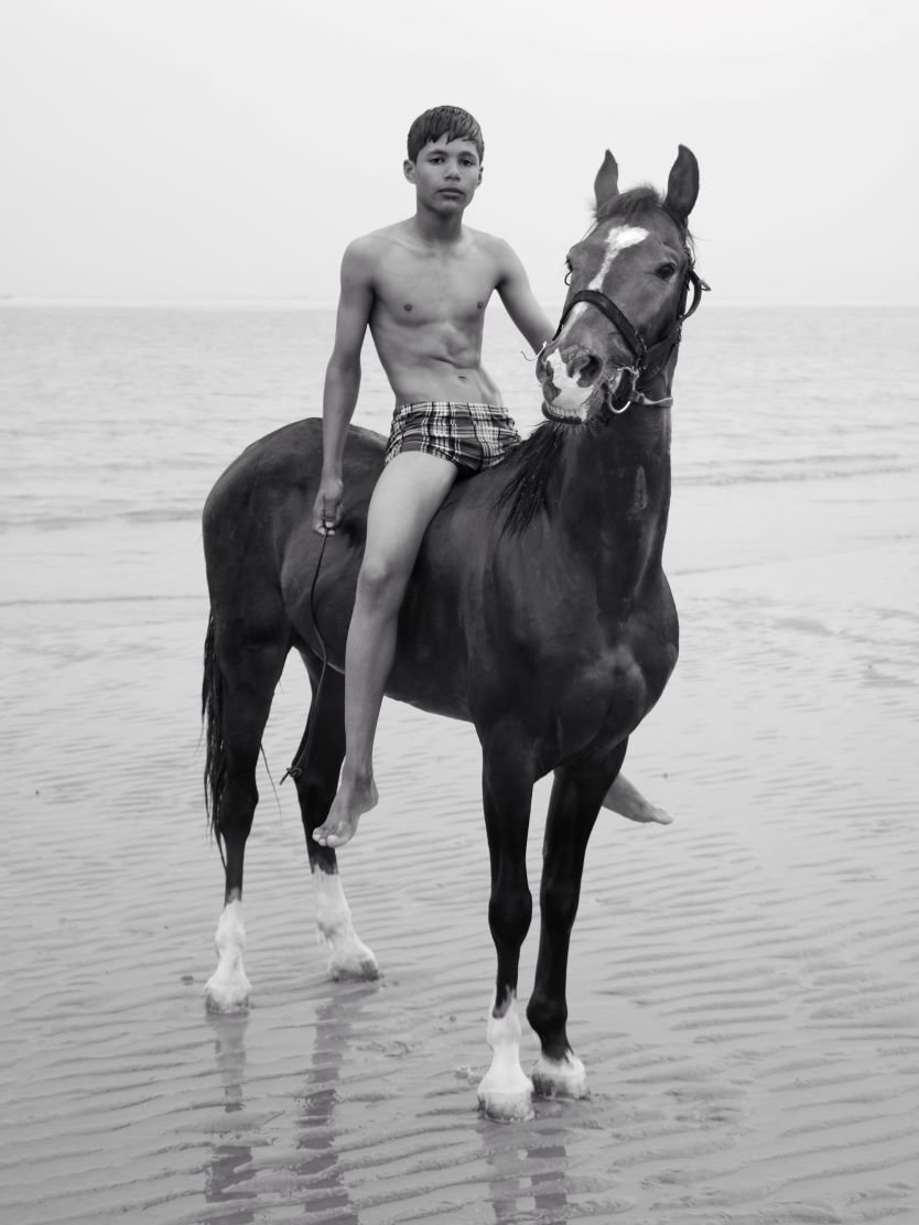 a boy and a horse by Ali Saeedi